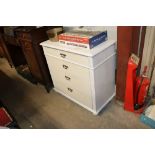 A white painted pine chest fitted four long drawer