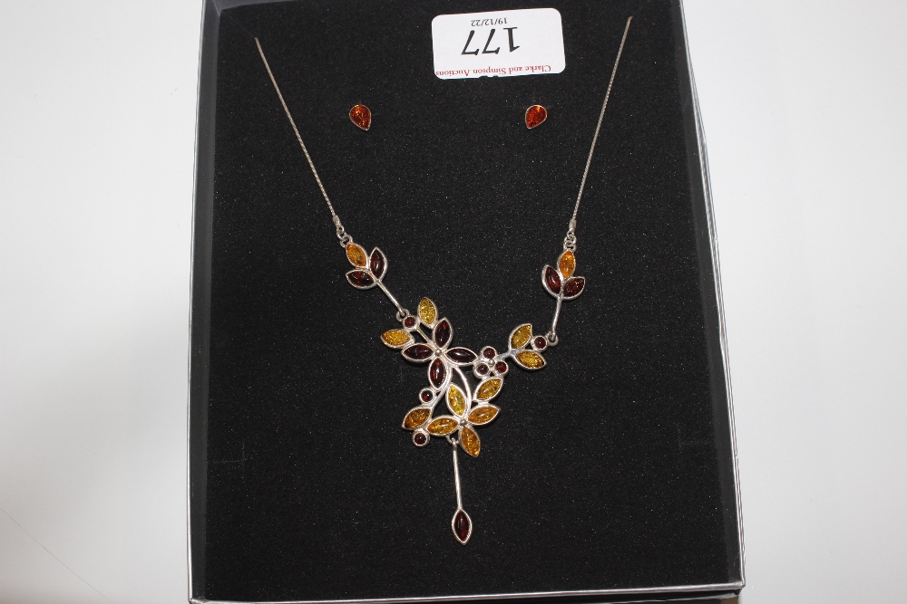 A Sterling silver and amber set necklace with simi