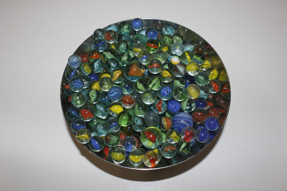 A bowl of various glass marbles