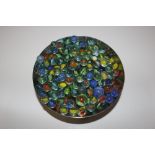 A bowl of various glass marbles