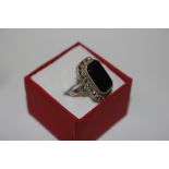 A vintage Sterling silver marquisate and black ony