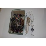 A box containing various costume jewellery