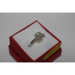 A vintage Sterling silver and diamond set ring siz