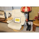 A Stressless cream upholstered swivel armchair