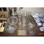 A quantity of various glass jugs, vases, jars and
