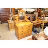 A satin walnut dressing chest fitted three long dr