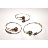 Four white metal and hardstone set bangles