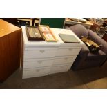 A pair of modern bedside chests fitted three drawe