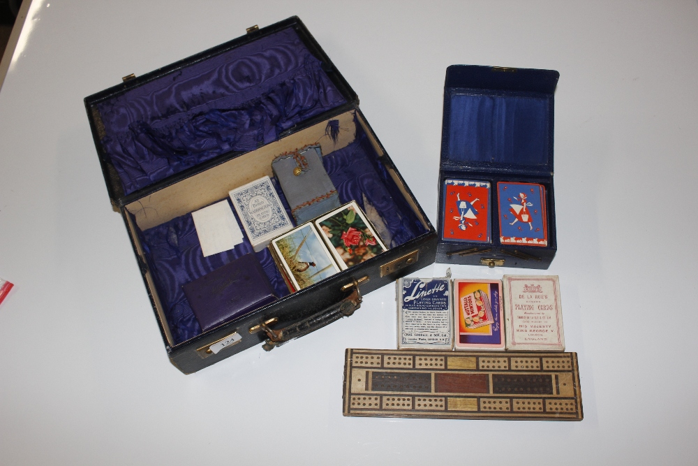 A leather suitcase AF and contents of cribbage boa