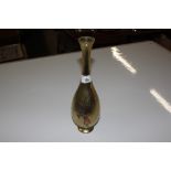 A brass vase with white metal and copper overlay d