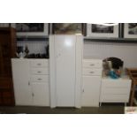 A white painted wardrobe; two cupboards each fitte