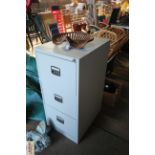 An as-new three-drawer filing cabinet with key