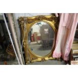 A modern ornate gilt framed mirror AF