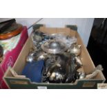 A box containing various silver plated items inclu