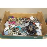 A box containing a large quantity of costume jewel