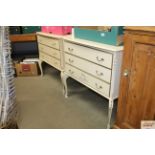 Two cream and gilt decorated three drawer bedroom