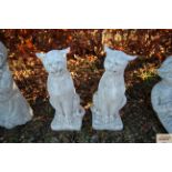 Two concrete garden ornaments in the form of wild cats