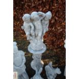 A garden ornament in the form of cherubs on a colu