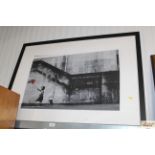 A photographic print, after Banksy