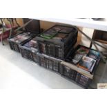 Five boxes of assorted DVDs