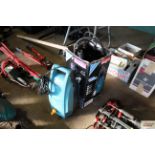 A Makita pressure washer and attachments