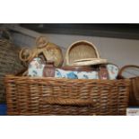 A wicker basket containing a bag and other wicker
