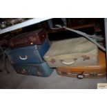 A collection of various vintage luggage