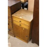 An oak two drawer bedside cabinet