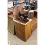 A walnut cased Singer sewing machine