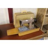 A Singer electric sewing machine with case but lac