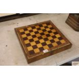 A walnut and inlaid folding games board and a quan