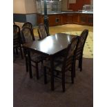 A table 120cm x 75cm and four chairs