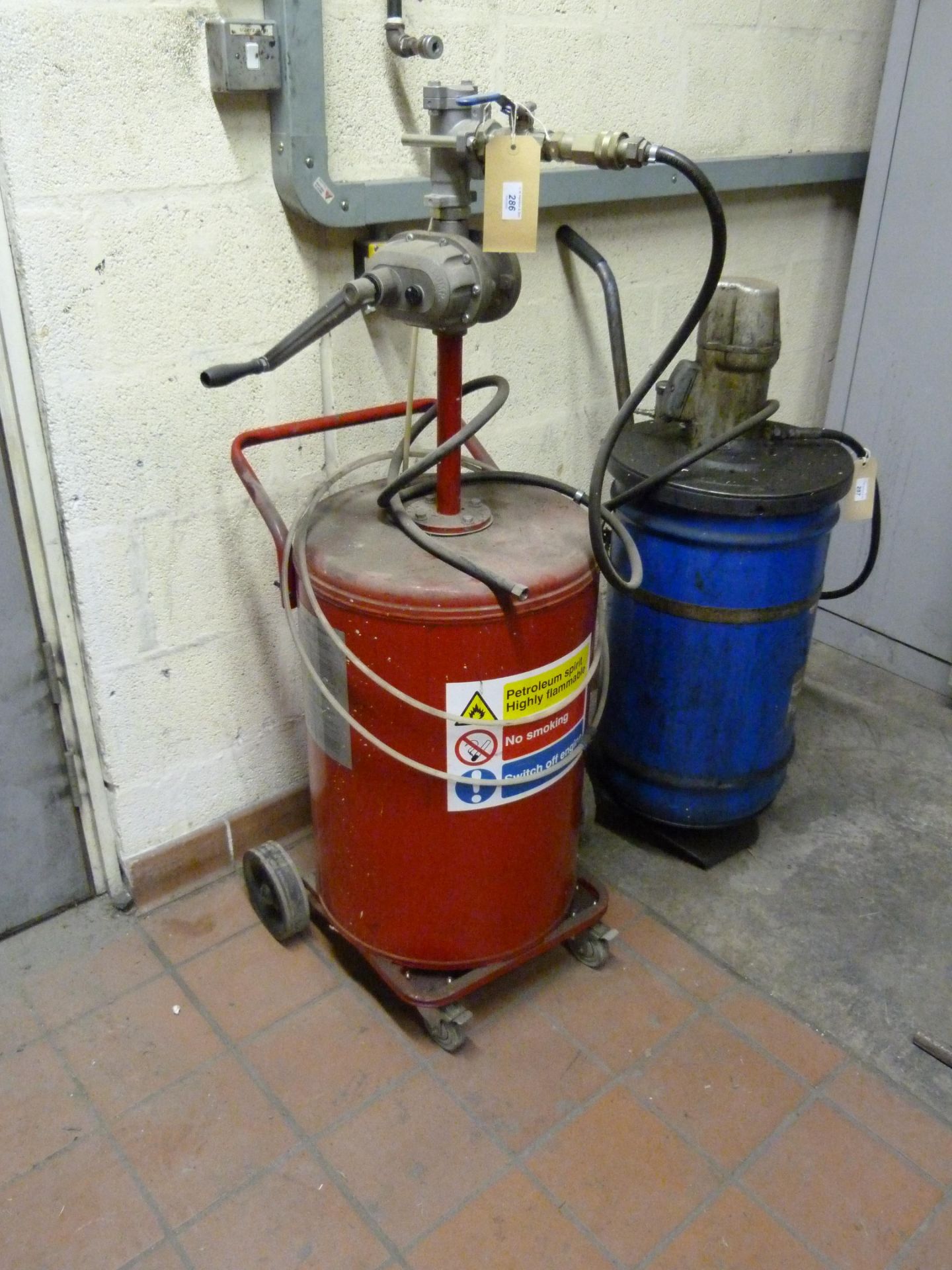 A mobile hand pump petroleum spirit dispenser