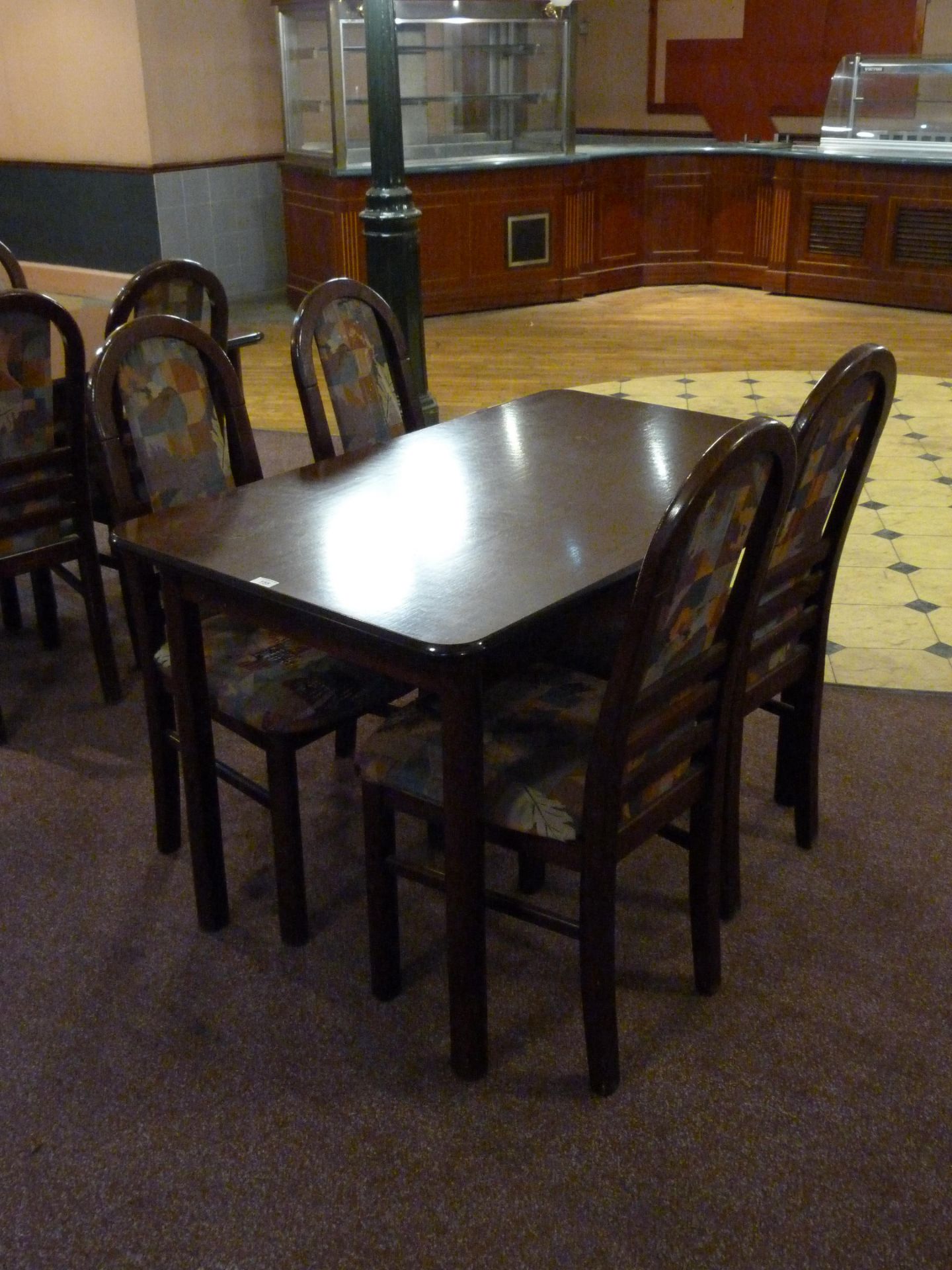A table 120cm x 75cm and four chairs