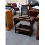 A mobile wooden trolley with two leaves and drawer with small mirror