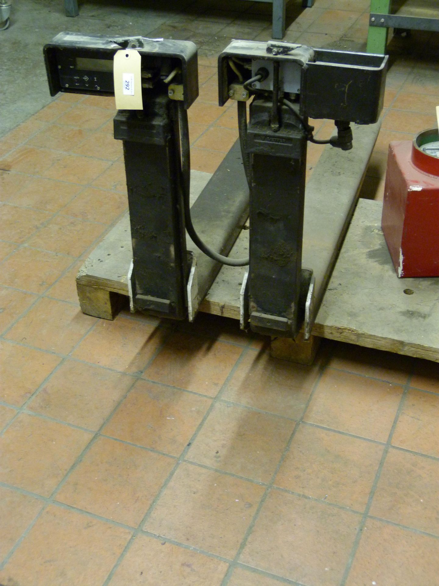 A pair of fork lift forks with Timotex LTD GSF1150 attached scales