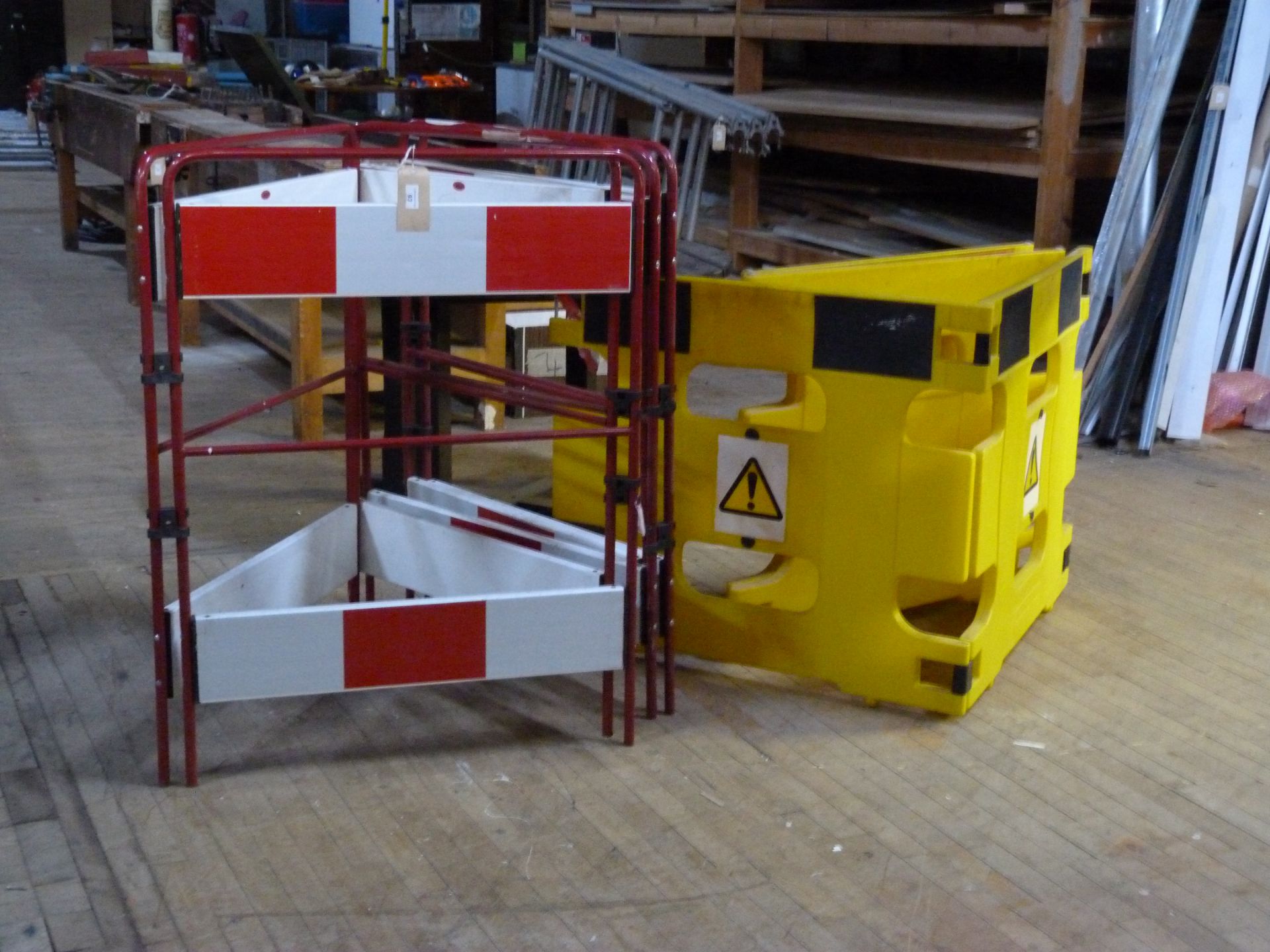 Three JSP folding safety barriers