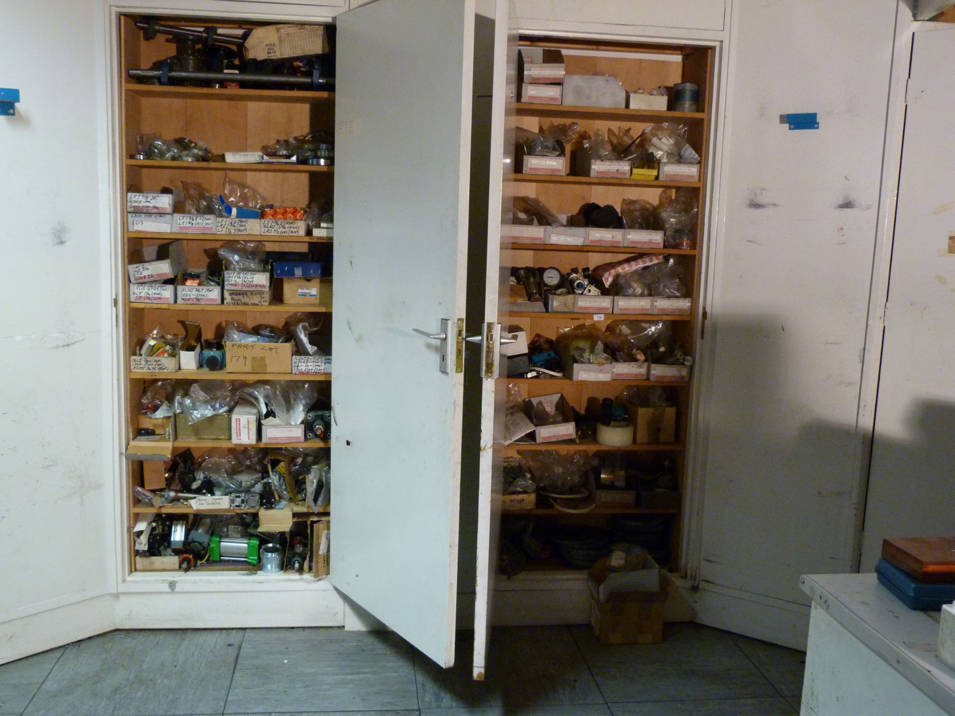 Contents of two cupboards to include various pneumatic components,