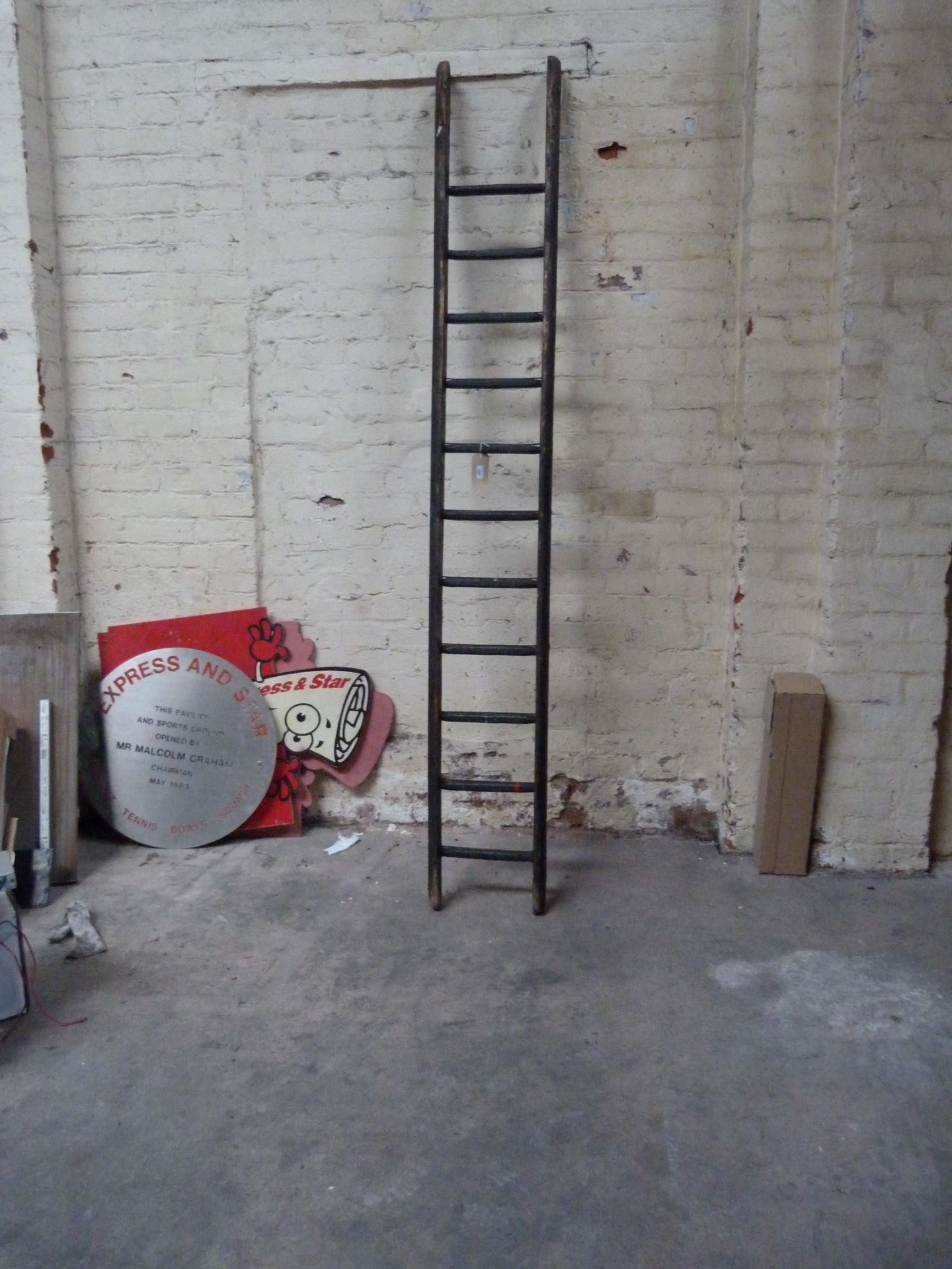 An eleven rung wooden ladder
