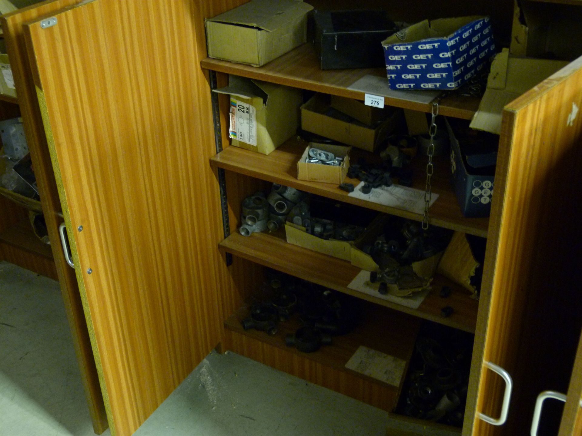 Contents of four cupboards to include various electrical fittings