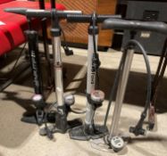 Four assorted large bike hand pumps by Muddy Fox, Pro Cycle, etc.