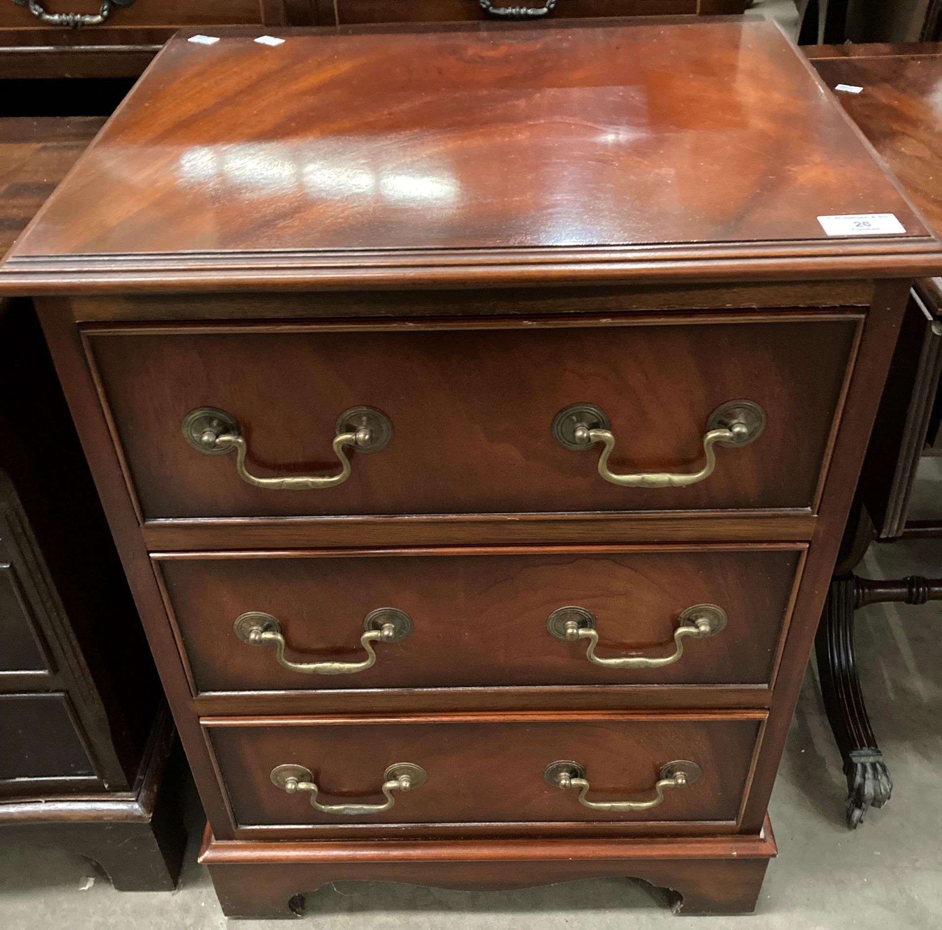 A small mahogany three drawer chest of drawers 50cm x 65cm high