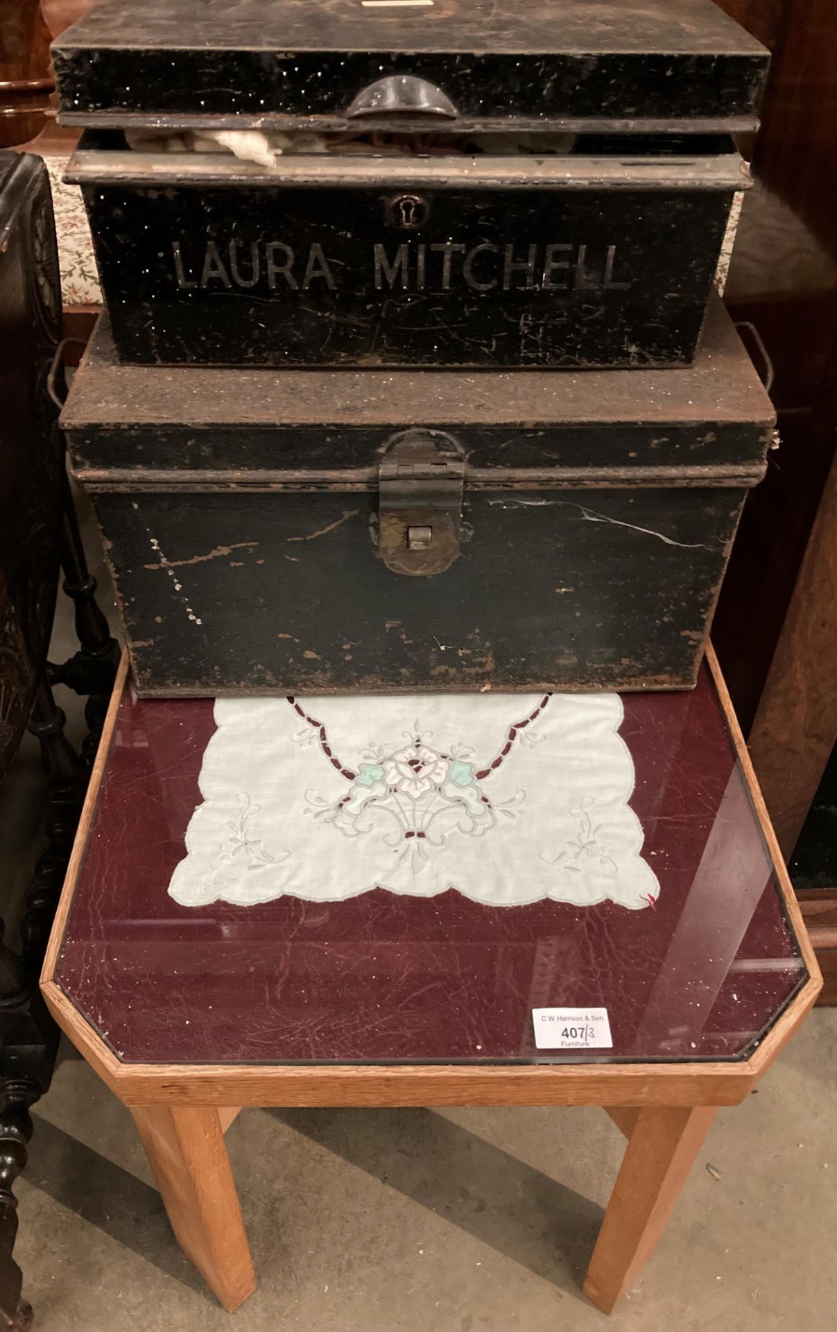 Two small black metal deed boxes (no keys) and a small oak framed glass top table (3)