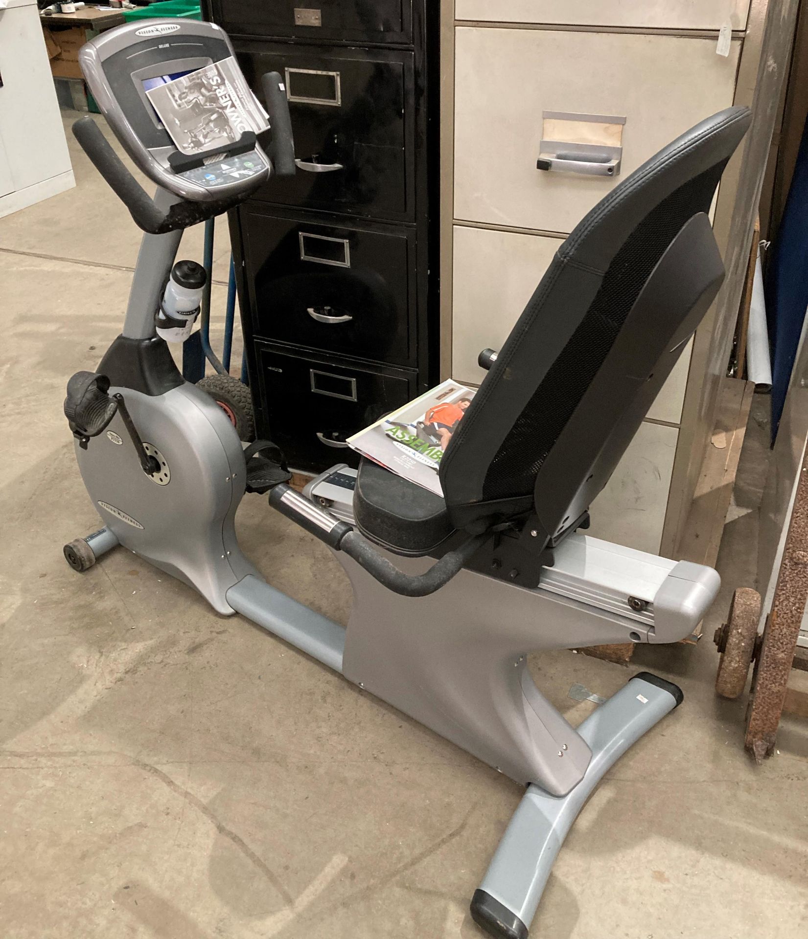 A Vision Fitness R2250 step-thru semi recumbent fitness bike with digital read out and manual