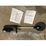 A GC-1015 metal detector with manual