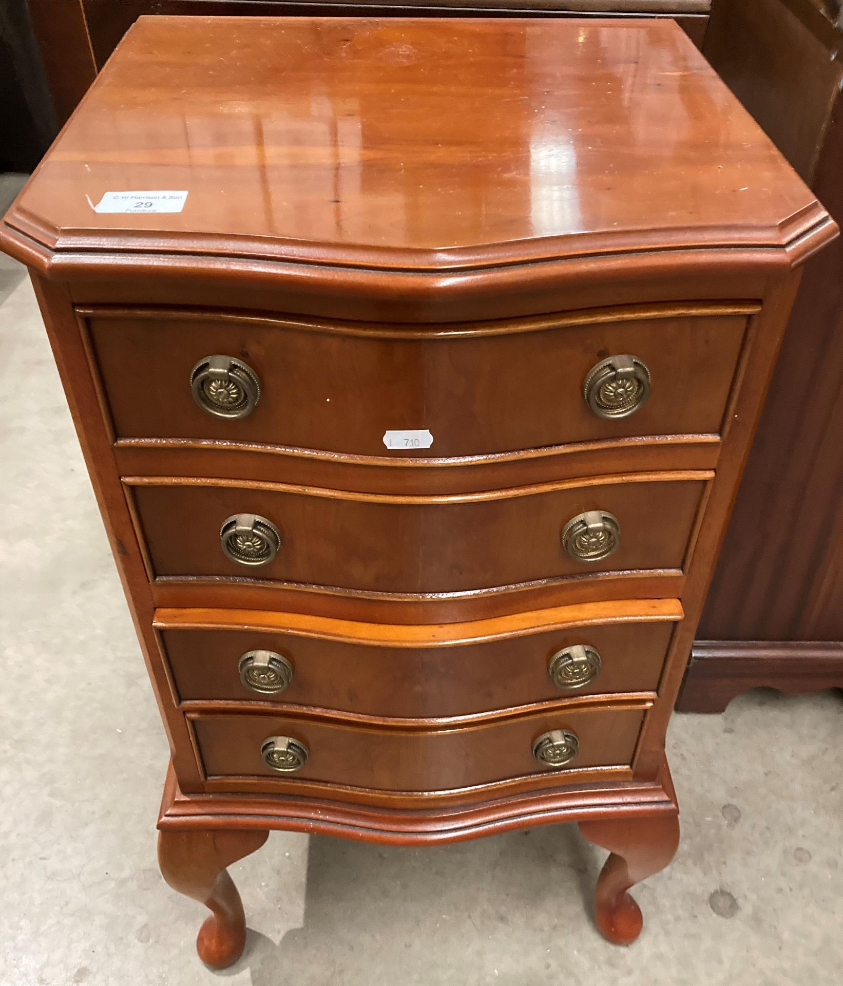 A small yew finish four drawer bow front chest of drawers 40cm x 72cm high on cabriole legs and