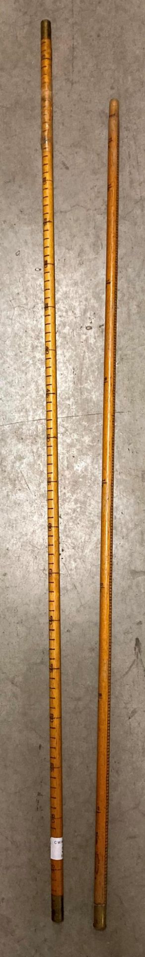 Two Rabone tubular wooden rulers, 1 metre and 1 yard (metre one is cracked,