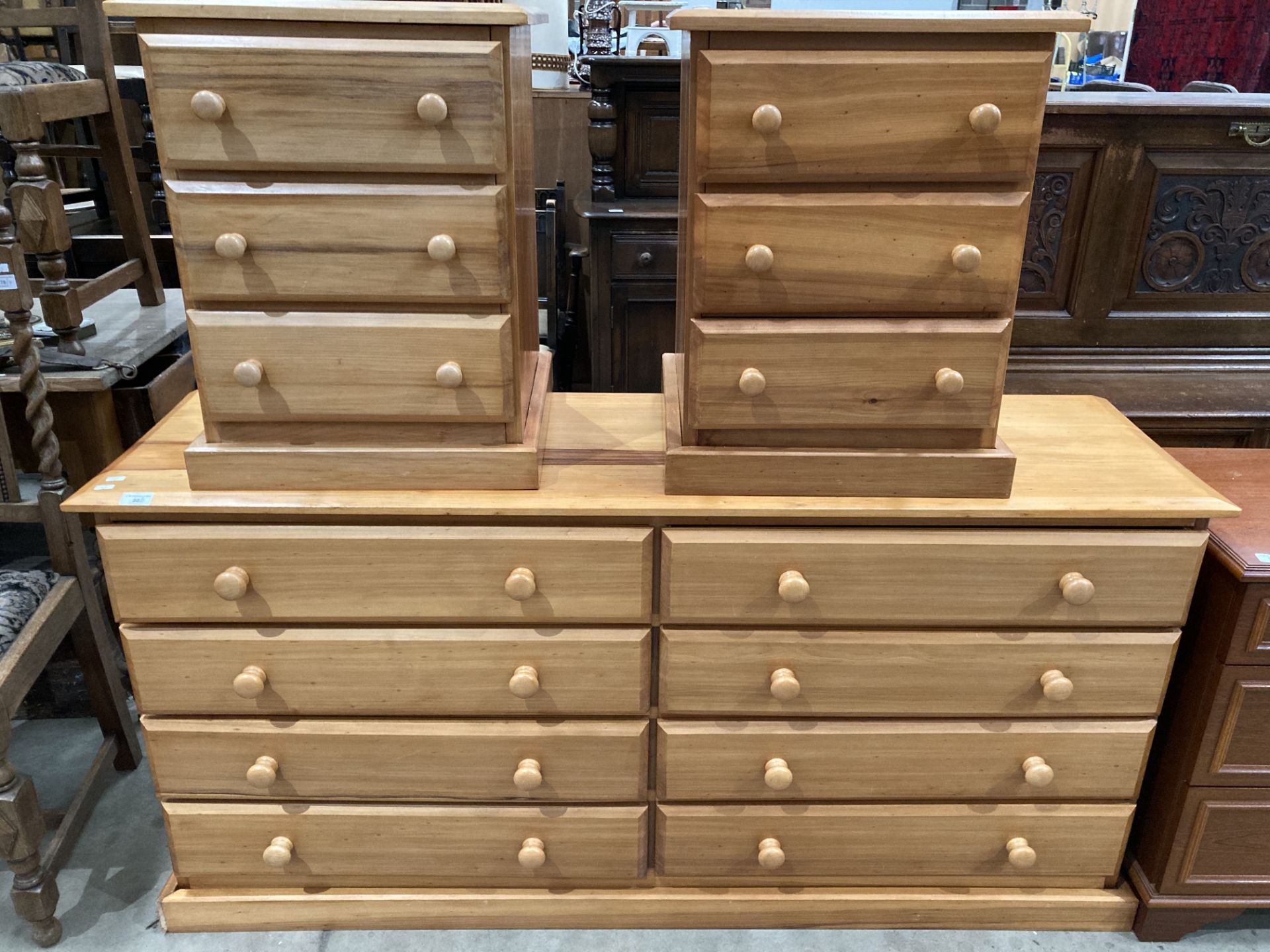 A pine double eight drawer chest of drawers 155cm x 78cm high and two pine three drawer bedside