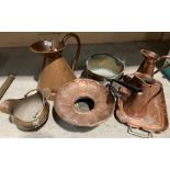 Eight items - copper and brass ware including two pans, jugs,