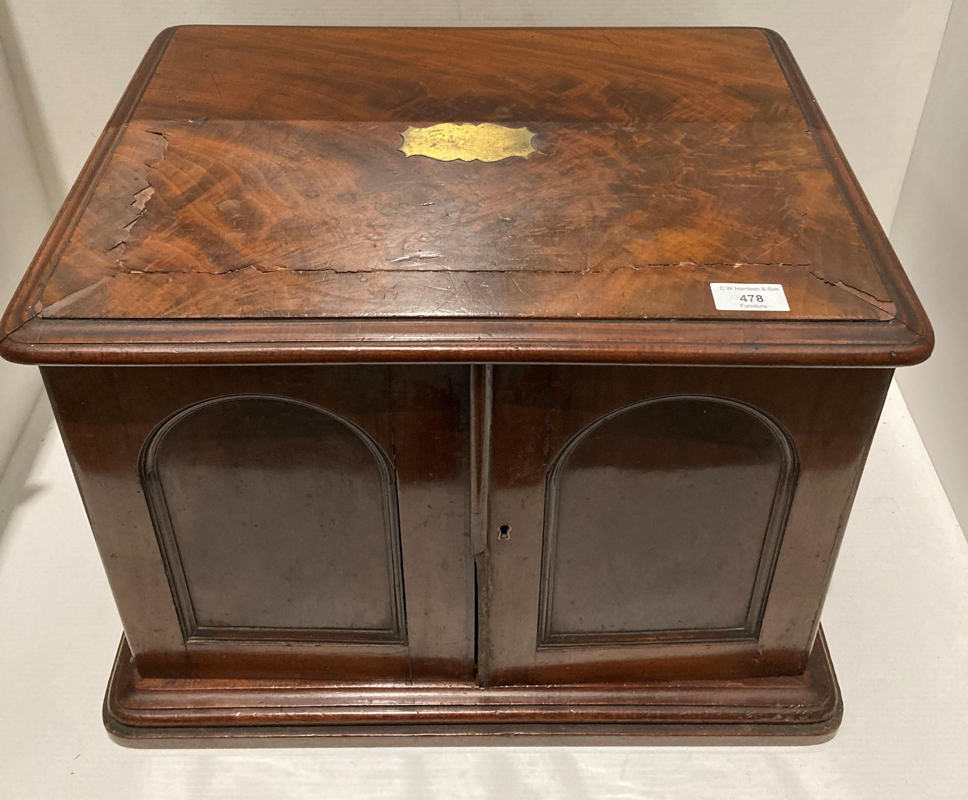 A mahogany table top two door,